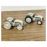 pair of 7' long cast antqiue tractors