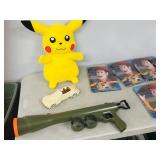 kids items, banners, gun, Pikachu stuffie