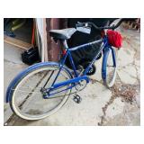 Raleigh transit bike with red bag