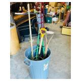 garbage pail with yard tools & misc