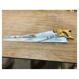 painted & signed hand saw-