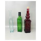 3 colored glass bottles