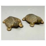 pair of heavy cast turtles