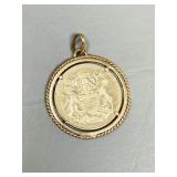 14k gold medal (19.4g) in 10k bezel (3.83g)