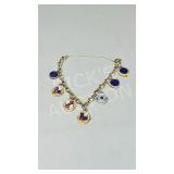 10k gold charm bracelet & 4 gold charms