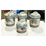 4 signed stoneware lidded cannisters