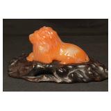 Hand-Carved Jade Lion Figurine on a Wooden Base