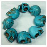 Carved Turquoise-colored Howlite Skulls Bracelet