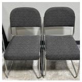2 Gray Padded Fabric Stacking Chairs