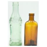 2 ANTQ Glass Bottles