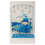 Metal snowman welcome sign