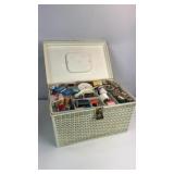 Vintage plastic sewing box filled with accessories