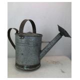 Vintage galvanized watering can
