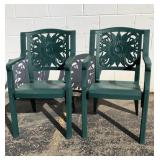 Pair of green plastic outdoor chairs