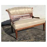 Carved wood upholstered loveseat