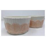 Two shell-themed pots