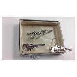 Rifle-themed set of cuff links and tie clip