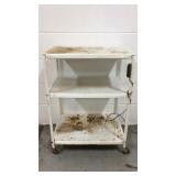 Metal cart with casters and electrical outlet
