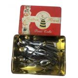 Hostess House Fruit Cake Tin with Mixed Flatware