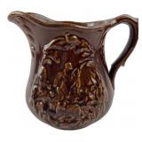 Brown Glazed Relief Molded Ceramic Pitcher