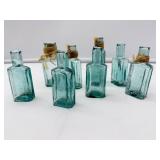 Eight Blue Glass Bottles