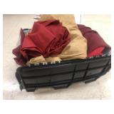 Large bin of fabric table cloths