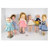 (6) Assorted Dolls & Suitcase