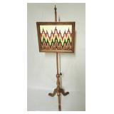 Vintage needlework on maple stand