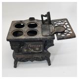 Crescent toy stove as found