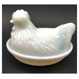 Petite opalescent hen on nest