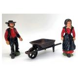 Cast iron Amish man woman wheelbarrow