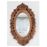 Small carved wooden accent mirror