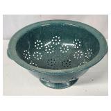 Green enamelware colander