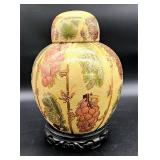 Chinese porcelain jar on wooden stand