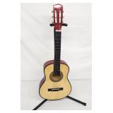 Ukelele youth guitar on stand