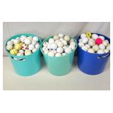 Three small buckets used golf balls