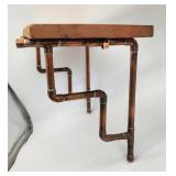 Unique copper tubing wall shelf