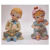 2 porcelain piano babies