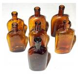 Antique amber glass 1/2 pint flasks