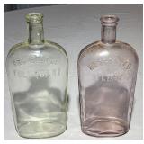 Antique colored glass quart flasks
