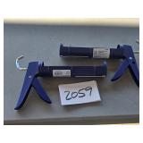 NEW - 2 caulking guns