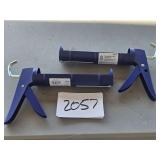 NEW - 2 caulking guns