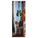 A Stool and two metal guitar decorations