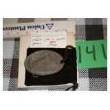 a belt buckle from Rca