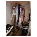 Gold clothing rack with clothes