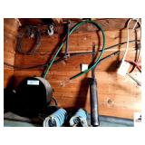 (2) AUTOMOTIVE SPRINGS  - SQUIRREL CAGE FAN  - ELEC. CORD - CHAIN HOOK - LARGE TIRE TOOL -  FREEZE TEST - LAWN MOVER USED CABLES - RUBBER FUELS PUMP - (2) METAL STOOL BASES - TRAILER HITCH FRAME & BAL