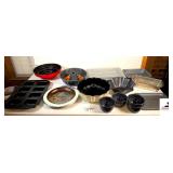 ASSORTMENT OF BAKING SHEETS & PANS - (2) BUNDT CAKE PANS - LAYER CAKE PAN - MINI LOAF BAKING SHEET - PIE CRUST SHIELD - TORTILLA SHELL BAKING BOWL - ALUMINUM CAKE PAN WITH LID - SMALLER CAKE PAN - MEA