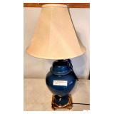 BLUE TABLE LAMP WITH SHADE- BLUE GLASS BASE- CREAM SHADE- BRASS BOTTOM_x000d_
_x000d_
GARAGE
