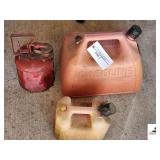 (3) GAS CANS- (1) 5 GALLON PLASTIC GAS CAN- (1) 1 GALLON VINTAGE METAL GAS CAN- (1) 1 GALLON PLASTIC GAS CAN