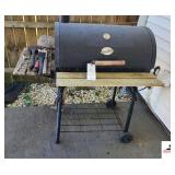 CHAR-GRILL BAR-B-Q  BARREL ROLLING CHARCOAL GRILL  WITH UTENSILS - INTERIOR GOOD - 1 RACK HAS SMALL PIECE MISSING NEAR FRONT - (2) BAGS OF CHARCOAL